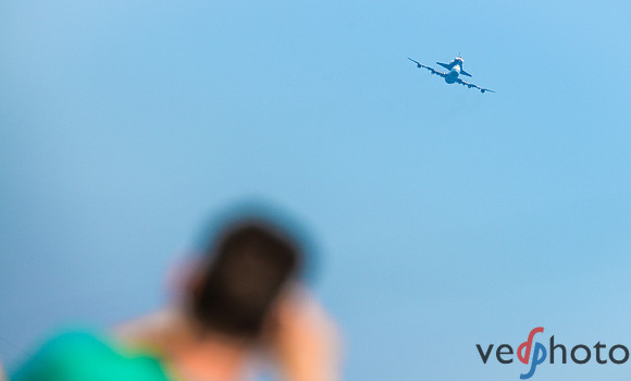 A NASA Ames employee snaps a pic of the Space Shuttle Endeavour Flyover