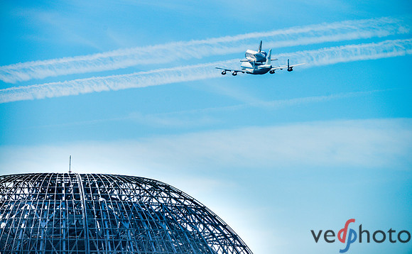 Space Shuttle Endeavour flying over NASA Ames hangar