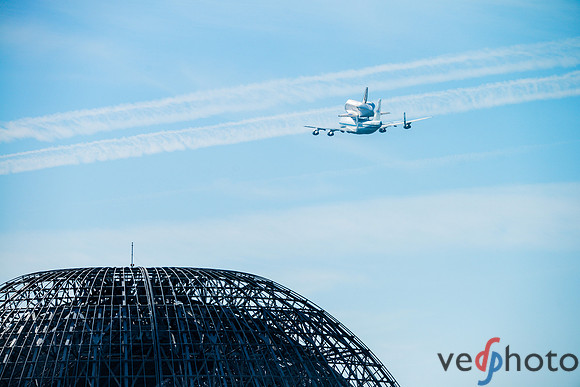 Space Shuttle Endeavour flying over NASA Ames hangar
