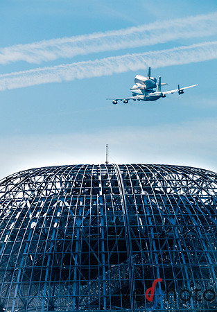 Space Shuttle Endeavour flying over NASA Ames hangar